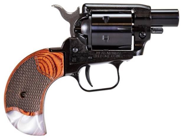 Compact vintage revolver with amber wood grain grip, sleek black finish, and precise craftsmanship.