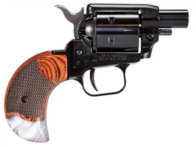 Compact vintage revolver with amber wood grain grip, sleek black finish, and precise craftsmanship.