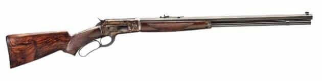 Elegant lever-action rifle with polished barrel and dark wood stock, perfect for collectors.