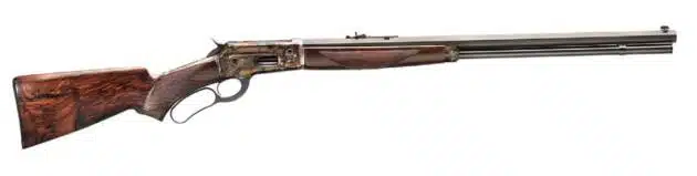 Elegant lever-action rifle with polished barrel and dark wood stock, perfect for collectors.