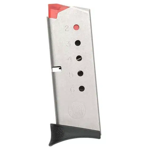 Durable metal firearm magazine with red follower and textured grip for easy handling.