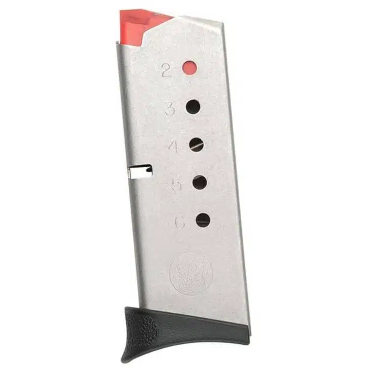 Durable metal firearm magazine with red follower and textured grip for easy handling.