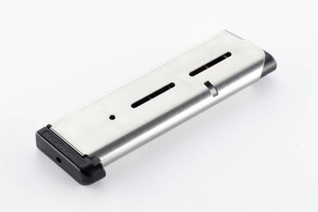 Sleek silver magazine with matte black base and round indicator slots for firearms.