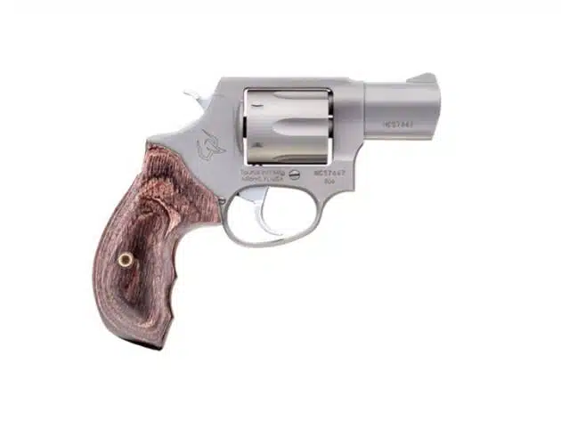 Sleek stainless steel revolver with elegant wood grip, perfect for concealed carry and personal defense.