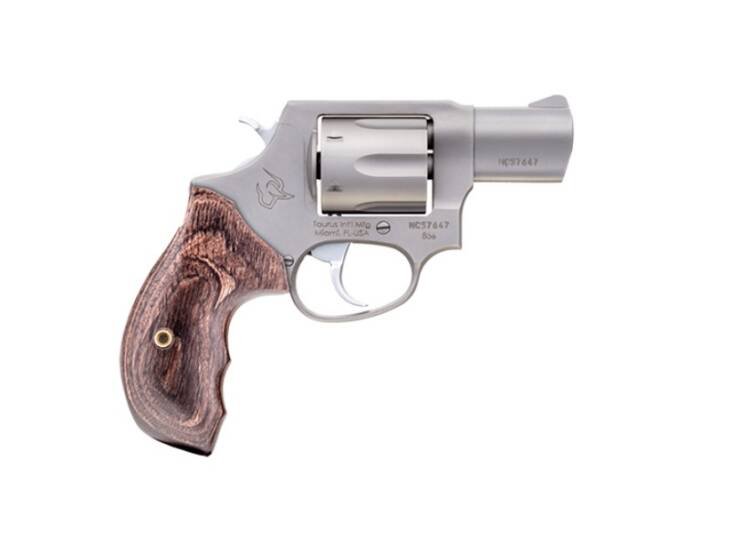 Sleek stainless steel revolver with elegant wood grip, perfect for concealed carry and personal defense.
