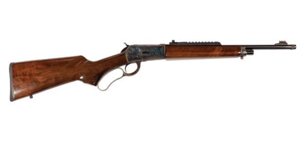 Classic lever-action rifle with wooden stock and metal receiver, ideal for collectors and hunters.