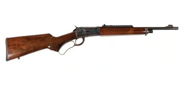 Classic lever-action rifle with wooden stock and metal receiver, ideal for collectors and hunters.