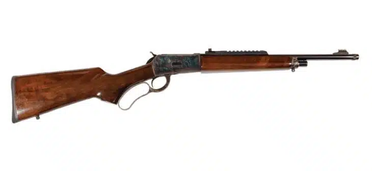 Classic lever-action rifle with wooden stock and metal receiver, ideal for collectors and hunters.