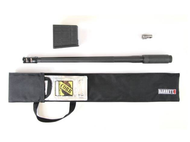 Matte black precision shooting accessories including barrel, suppressor, muzzle device, and carrying case.