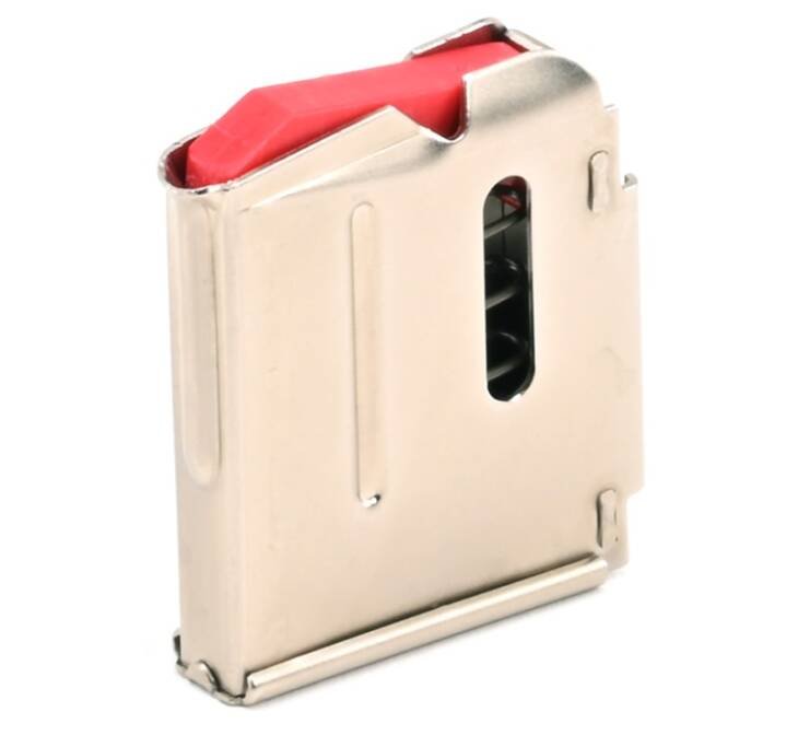 Polished metal firearm magazine with red follower and viewing window for easy round tracking.