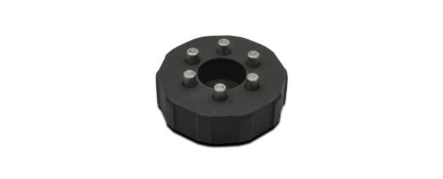 Versatile black mechanical component with bolt holes for automotive and industrial applications.