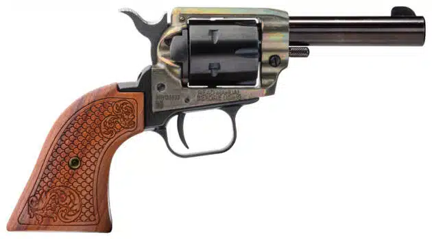 Antique Western revolver with ornate wooden grip and polished blued steel finish for collectors.