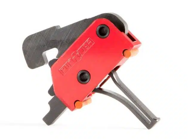 Ergonomic red clamp tool for secure gripping in industrial applications and demanding environments.