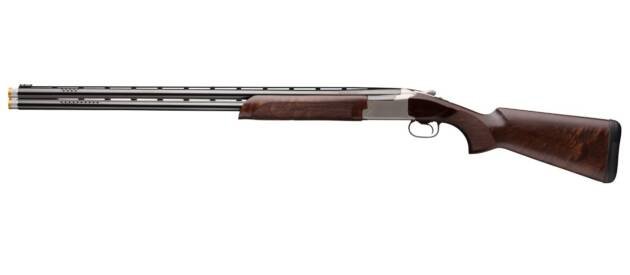 Elegant double-barreled shotgun with polished metal and walnut stock, ideal for hunting and sport shooting.