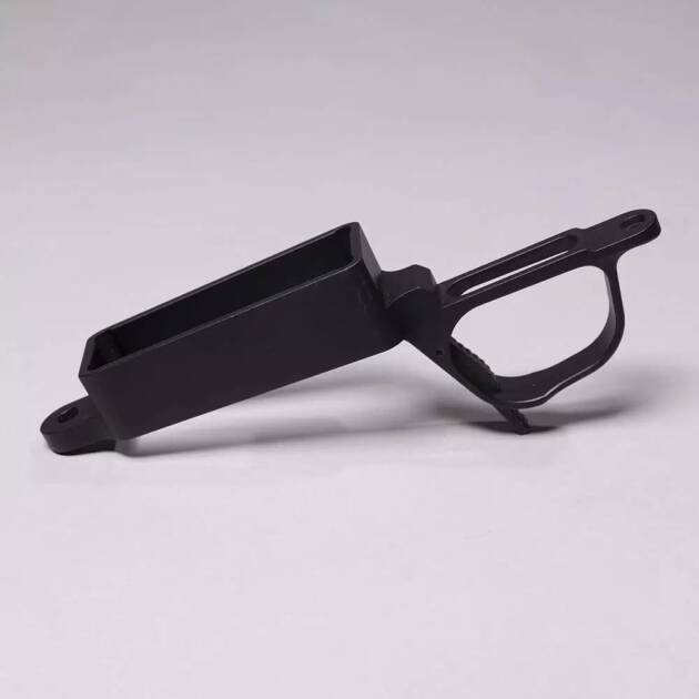 Ergonomic black plastic component with handle and hopper, designed for precision and durability.
