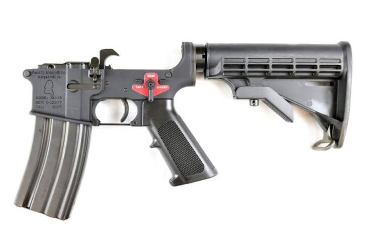 Sleek AR-15 rifle with ergonomic features, adjustable stock, and safety indicator for optimal performance.