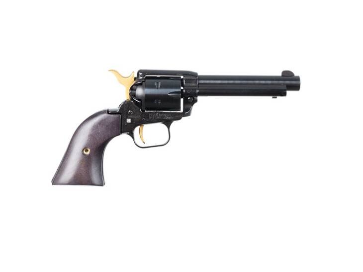 Classic black revolver with polished wood grip and elegant gold accents, ideal for collectors.