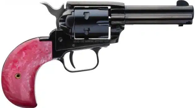 Compact revolver with pink grip and glossy black finish, merging classic style with modern flair.