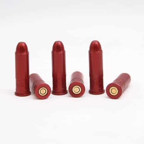 Set of five red non-lethal training bullet casings for safe firearm practice.