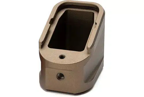 Durable tan magazine base pad for optimal grip and functionality in tactical scenarios.