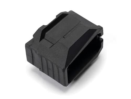 Compact black mounting component for versatile mechanical and electronic applications with textured grip.