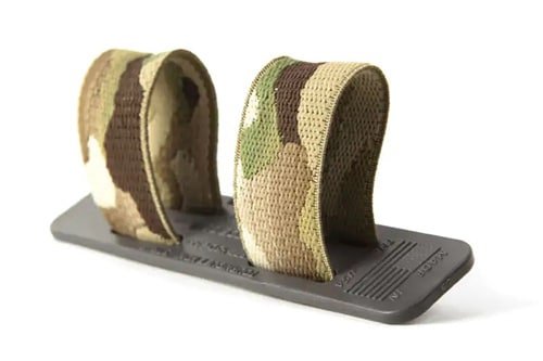 Durable camouflage straps for securing tactical gear in outdoor adventures.