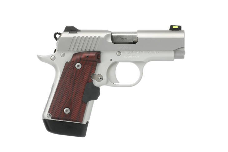 Sleek compact handgun with silver frame, wood grip, and green dot sight for precision and comfort.