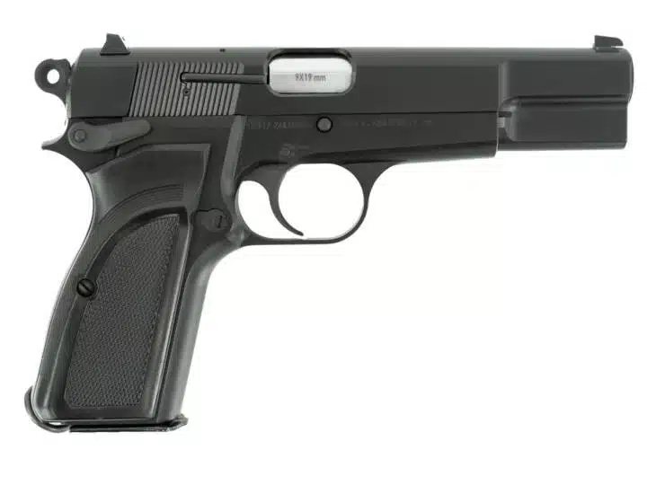 Sleek semi-automatic pistol with textured grip, matte black finish, and essential safety features.