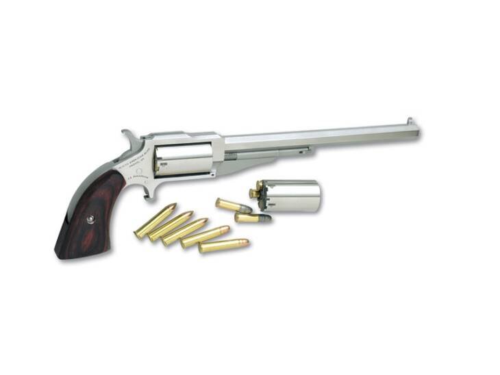 Sleek silver revolver with wood grip and brass casings, showcasing fine craftsmanship and design.