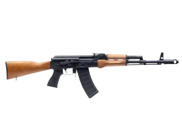 Classic assault rifle with wooden accents, loaded magazine, and ergonomic design for combat reliability.