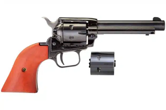 Classic polished revolver with wooden grip, long barrel, and detachable safety cylinder for collectors.