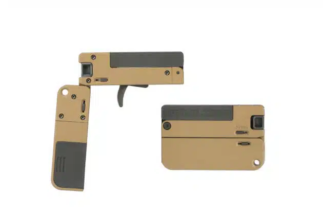 Compact foldable tan firearm for discreet self-defense and tactical portability.