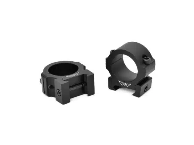 Durable black scope rings for rifles, designed for stability and precision in firearm optics.