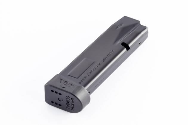 Sleek black firearm magazine with matte finish and witness hole for reliable performance.