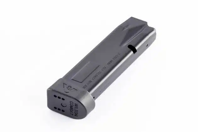 Sleek black firearm magazine with matte finish and witness hole for reliable performance.