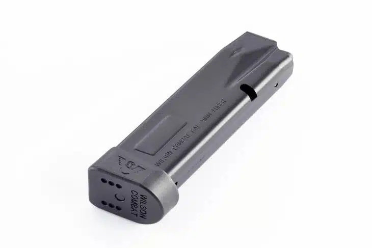 Sleek black firearm magazine with matte finish and witness hole for reliable performance.