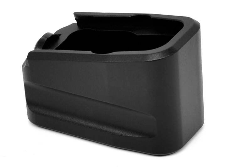 Black polymer magazine extension enhances firearm capacity and performance for tactical and competitive use.