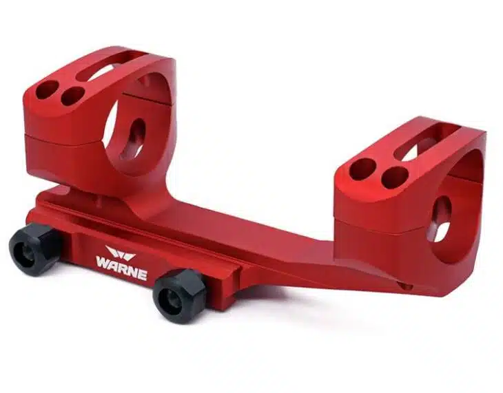 Anodized red scope mount for rifles, enhancing stability and style for tactical enthusiasts.