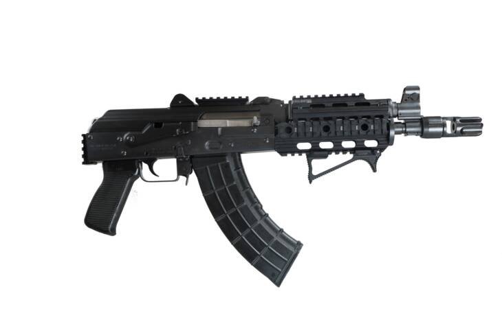 Sleek tactical rifle with hi-capacity magazine and customizable features for military and competitive use.