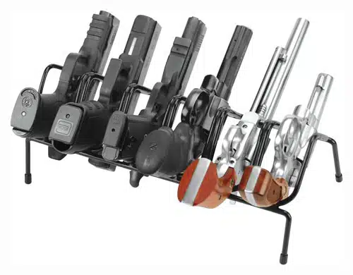 Organized display rack featuring a diverse collection of semi-automatic pistols and classic revolvers.