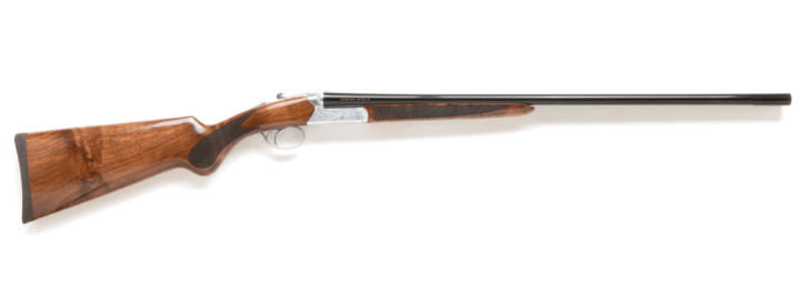 Elegant double-barrel shotgun with polished walnut stock, perfect for collectors and hunting enthusiasts.