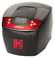 Efficient ultrasonic cleaning device for firearms, jewelry, and tools with sleek design and user-friendly controls.