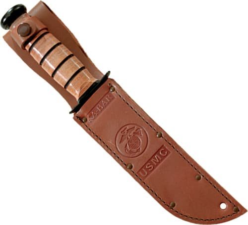 U.S. Marine Corps combat knife with durable blade and embossed leather sheath for outdoor use.