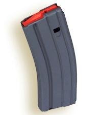 High-capacity curved magazine with red follower for reliable semi-automatic firearm performance.