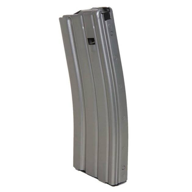 Curved metal firearm magazine for reliable feeding and enhanced performance in rifles.