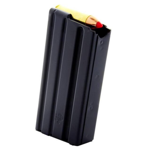 Black firearm magazine with yellow pencil, showcasing durability and a playful contrast in design.
