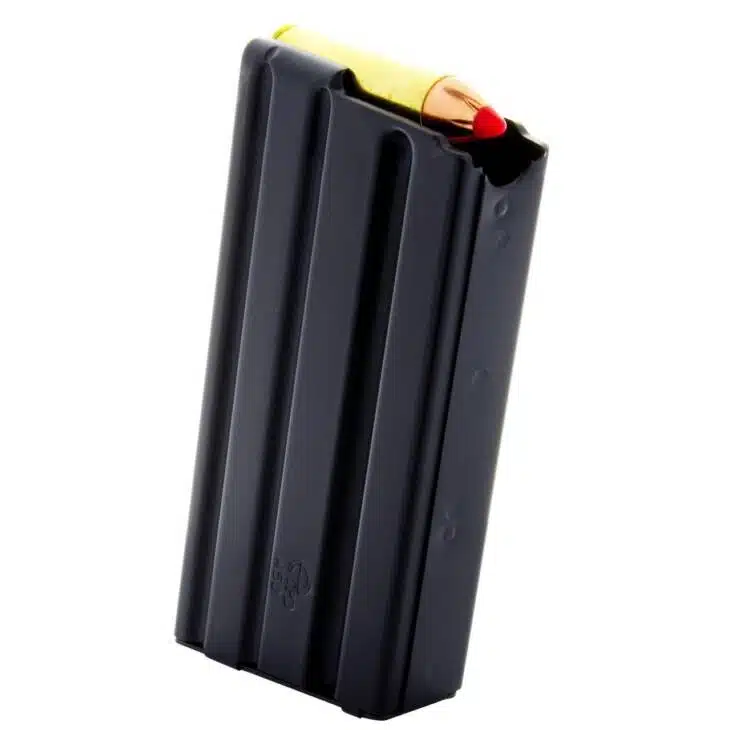 Black firearm magazine with yellow pencil, showcasing durability and a playful contrast in design.