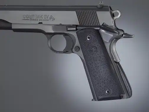 Colt M1911 semi-automatic handgun with textured grip, polished frame, and precision craftsmanship.
