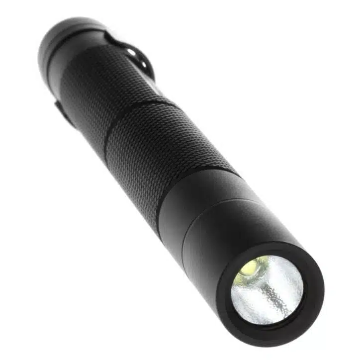 Durable LED flashlight with textured grip, bright light, and portable side clip for versatile use.