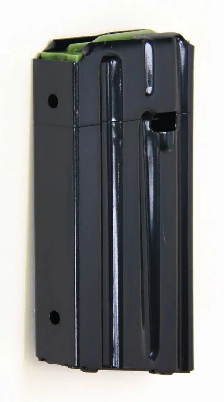 Durable black firearm magazine with green follower, optimized for sport shooting and tactical use.